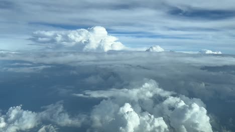 Pilot-point-of-view-durting-cruise-level-while-flying-between-stormy-clouds