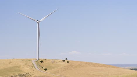 Idaho-wind-turbine-turning-in-the-wind-overlooking-miles-of-farm-land