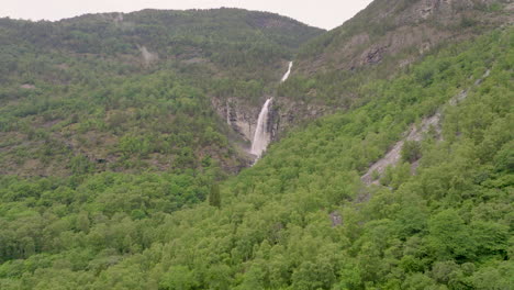 Stodnafossen-Waterfall-in-Norway,-beautiful-aerial-drone,-lush-green