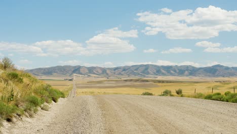 A-long-country-road-leading-to-miles-of-farms-and-farmland-in-eastern-Idaho