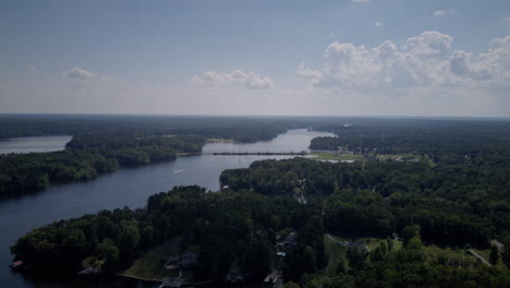 Aerial-hyperlapse-timelapse-of-a-bridge-on-Hyco-Lake-North-Carolina-in-the-afternoon-sun