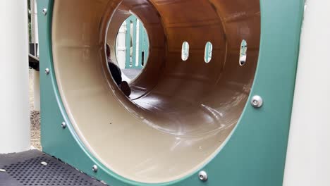 Toddler-crawling-in-playground-tunnel