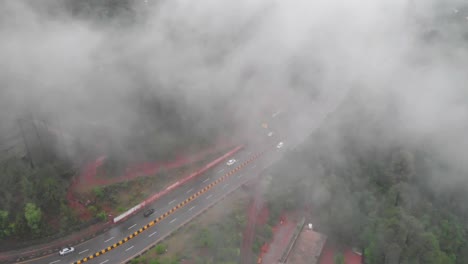 Aerial-Birds-Eye-View-Of-Muree-Expressway-Through-Misty-Foggy-Trees