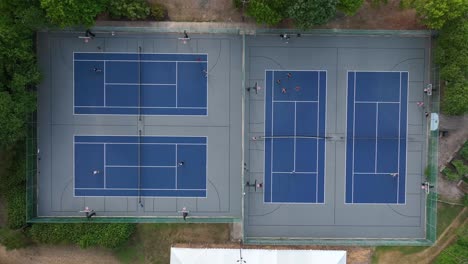 Top-down-aerial-of-tennis-and-basketball-courts