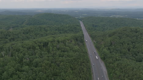 Aerial-footage-of-green-trees-in-the-mountains-focused-on-Interstate-40-in-North-Carolina