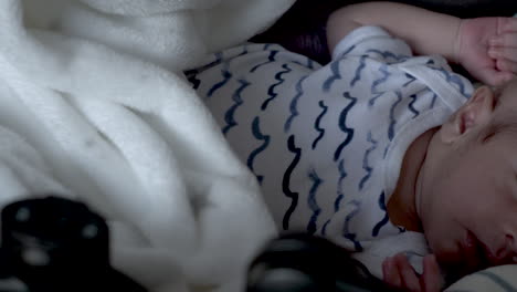 Newborn-Baby-With-Shaved-Head-Sleeping-In-Crib