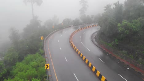 Aerial-Dolly-Back-Over-Four-Lane-E75-Expressway-On-Misty-Foggy-Day