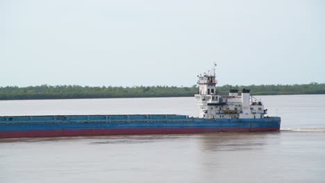 A-vessel-is-sailing-slowly-on-Paraná-river,-Argentina