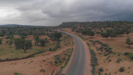 Aerial-View-Of-Empty-Remote-Highway-With-Overcast-Clouds-In-Punjab