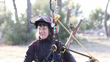 30-years-old-beautiful-smiley-woman-is-happy-while-climbing-down-from-a-pine-tree-after-pruning-it-in-North-Spain