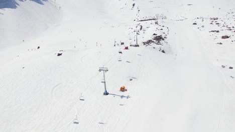 Modern-Ski-Chair-lift-In-Portillo-Ski-Resort-In-Chile---aerial-drone-shot