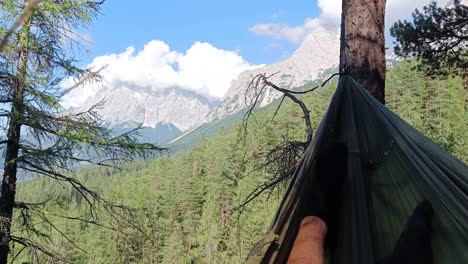 Person-lies-in-Hammock-with-amazing-view-over-Mountain-Zugspitze