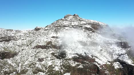 A-sunny-clear-day-with-thin-clouds-on-top-of-the-mountain-Pico-Ruivo-in-Madeira