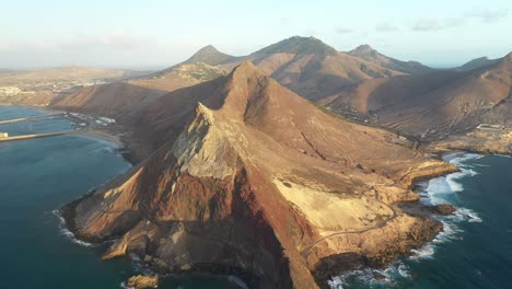Drone-shot-of-red-and-brown-mountains-in-Porto-Santo,-Madeira