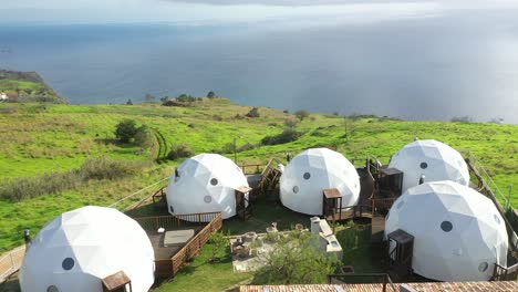 Drone-shot-over-igloo-glamping-tents-in-Madeira-with-amazing-view