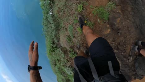 POV-shot-of-a-man-walking-fast-down-the-path-on-the-edge-of-Quebrada-do-Negro-in-Madeira