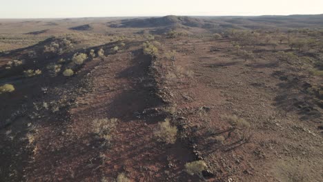 Aerial-footage-over-rocky-hills-near-Broken-Hill,-NSW,-Ausralia