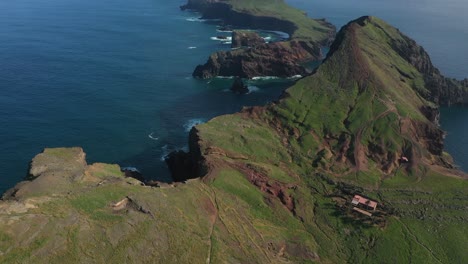 Drone-shot-over-the-edge-of-a-cliff-in-Sao-Lourenco,-Madeira