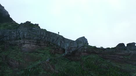 A-young-and-fit-man-is-walking-alone-up-to-the-peak-of-Pico-do-Arieiro-in-Madeira