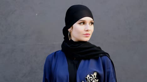 Portrait-of-Arabic-woman-wearing-Emirati-style-Abaya-and-Hijab-Shayla-headscarf