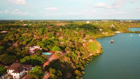 African-Landscape-With-Villas-On-The-Scenic-Coast-In-Kenya---aerial-drone-shot
