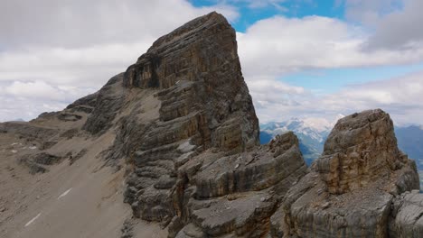 Aerial-Orbit-shot-showing-rocky-summit-of-Monte-Pelmo-and-clouds-at-sky-in-Italy