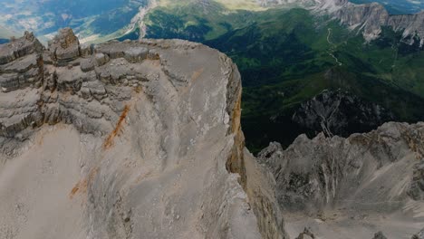 Aeria-tilt-down-shot-of-beautiful-mountain-range-and-rocky-steep-cliffs---Monte-Pelmo,Dolomites