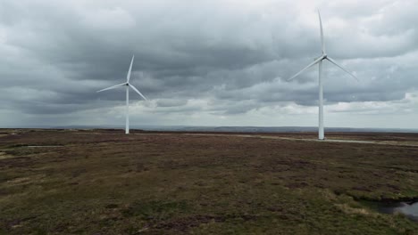 Drone-aerial-video-footage-of-a-wind-farm-and-wind-turbines-turning-in-the-wind