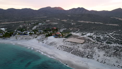 Drone-shot-in-rotational-view-of-the-hotels-near-the-beach-in-ensenada-de-los-muertos,-baja-california-sur-mexico