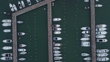 Aerial-birds-eye-shot-of-yachts-and-speedboats-parking-in-port-area