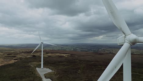 Close-up-drone-aerial-video-view-of-a-wind-farm-and-wind-turbines-turning-in-the-wind-1