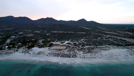 Side-drone-shot-of-breaking-waves-on-the-beaches-of-Ensenada-de-los-Muertos-in-Baja-California-Sur-Mexico