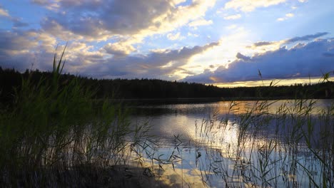 Time-lapse-of-lake-scenery-with-clouds-gathering-rapidly-in-sunset