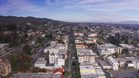 Descending-aerial-shot-flying-over-downtown-Ventura,-California