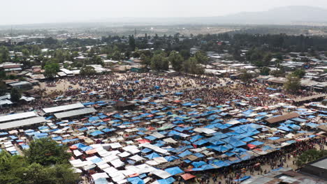 Panoramic-View-Over-Market-Stalls-In-Alaba-Kulito-Town,-Ethiopia---drone-shot