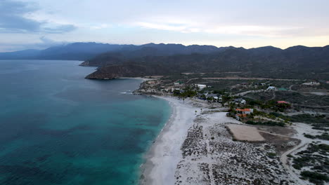 Drone-shot-in-reverse-of-the-bay-of-Baja-California-Sur-and-the-hotels-on-the-beach-line