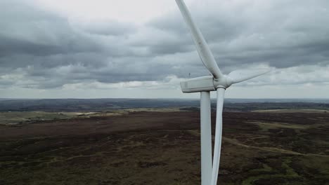 Drone-aerial-view-of-a-wind-farm-and-wind-turbines-turning-in-the-wind