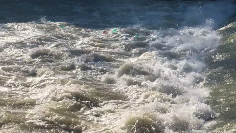 Dirty-plastic-water-bottles-in-a-river-weir-polluting-the-environment