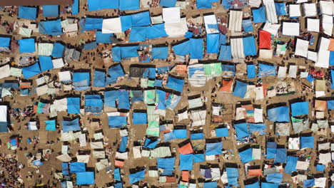 Top-Down-View-Of-Tents-In-Huge-Paprika-Market-Of-Alaba-Kulito-Town-In-Ethiopia---drone-shot