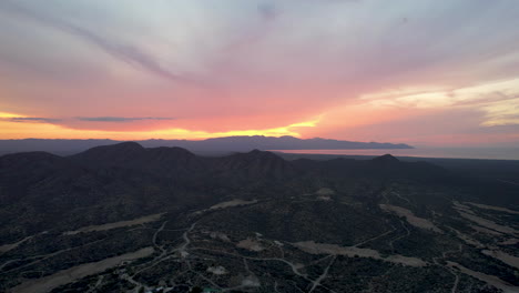 Drone-shot-of-deep-sunset-in-ensenada-de-los-muertos,-beach-in-mexico