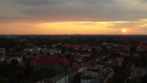 Paulsen-Gymnasium-High-School-at-Orange-mystique-sunset
Magic-aerial-view-flight-fly-backwards-drone
of-Berlin-steglitz-germany-at-summer-day-August-2022