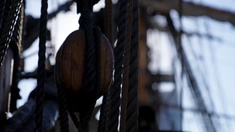 Old-naval-warship-rigging-shallow-depth-of-field-with-sun-glare-at-sea-concept