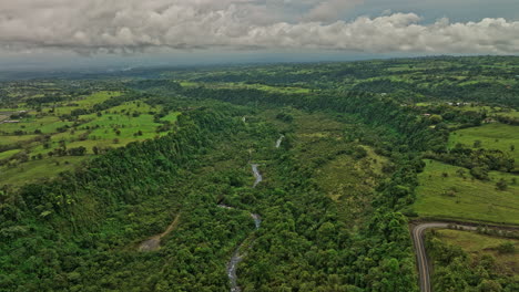 Cordillera-Panama-Aerial-v4-panoramic-landscape-view-fly-around-natural-terrains-capturing-beautiful-jungle-canopy,-canyon-macho-mote-river-and-green-pasture---Shot-with-Mavic-3-Cine---April-2022