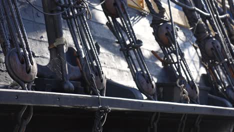 Close-up-shot-of-war-brigs-black-timber-frame-and-mast-rigging