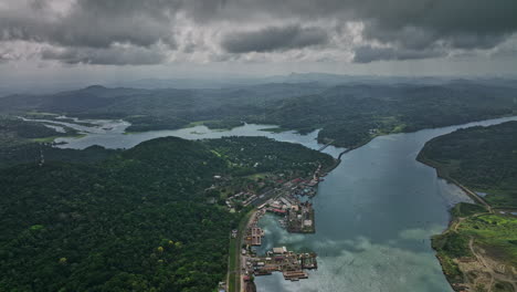 Panama-Canal-Aerial-v2-high-altitude-flyover-gamboa-capturing-natural-landscape-of-chagres-river-and-dense-forest-with-sunlight-shinning-through-stormy-clouds---Shot-with-Mavic-3-Cine---April-2022