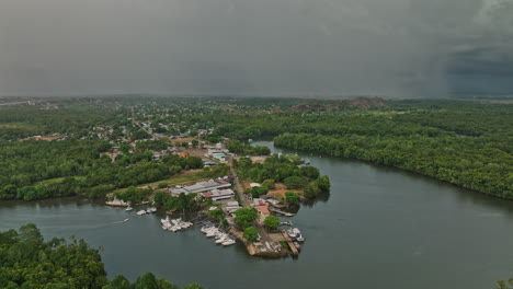 Pedregal-Panama-Aerial-v2-pan-shot-capturing-landscape-of-platanal-river-and-port-town-with-dark-clouds-in-the-sky-and-storm-approaching-during-raining-season---Shot-with-Mavic-3-Cine---April-2022