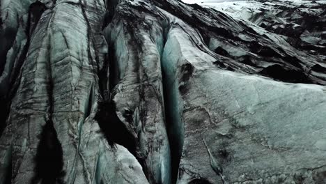 Aerial-view-of-Sólheimajökull-glacier-texture,-Iceland,-in-summer