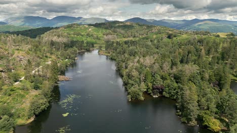 Drone-Aerial-footage-of-Cumbrian,-Tarn-Hows-Lake-District-National-Park-England-uk-on-a-beautiful-sunny-summer-day