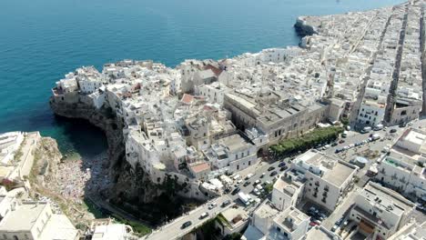 Drone-footage-was-taken-at-Polignano-a-Mare,-an-Italian-city-with-a-dense-population-and-many-buildings