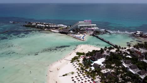 A-drone-shot-of-a-wonderful-view-of-the-tropical-seascape-of-north-beach-during-a-holiday-period-and-a-beautiful-luxury-hotel-is-seen-in-the-middle-of-the-turquoise-water